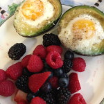 Baked avocado and egg brekkie with fruit.